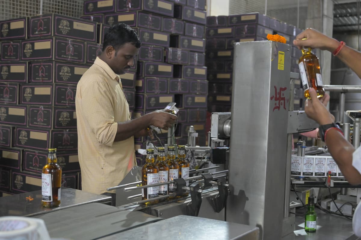 Hand bottling of premium whiskey with careful quality control